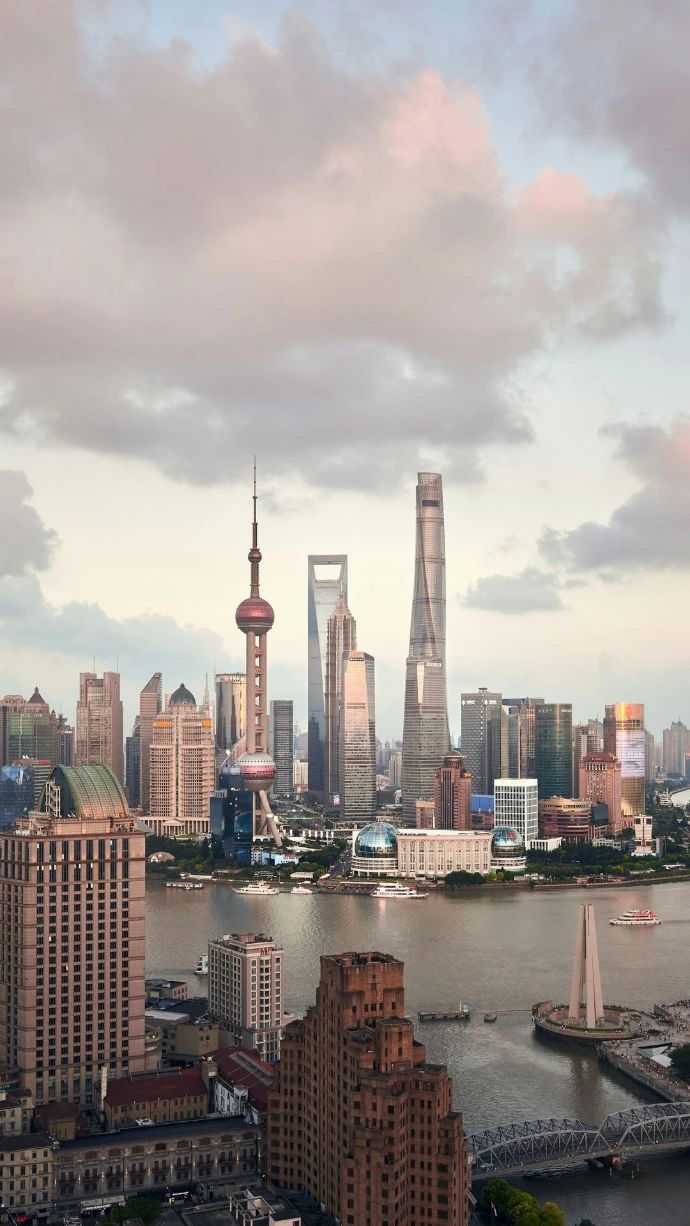 city skyline under cloudy sky during daytime